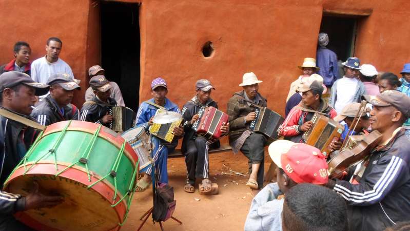 Traditional Malagasy folk musicians performing during a Famadihana celebration