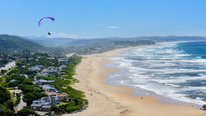 Paraglider over Wilderness beach