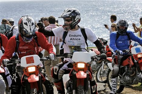 Britain's Prince Harry, center, gets ready for the start of Enduro Africa.