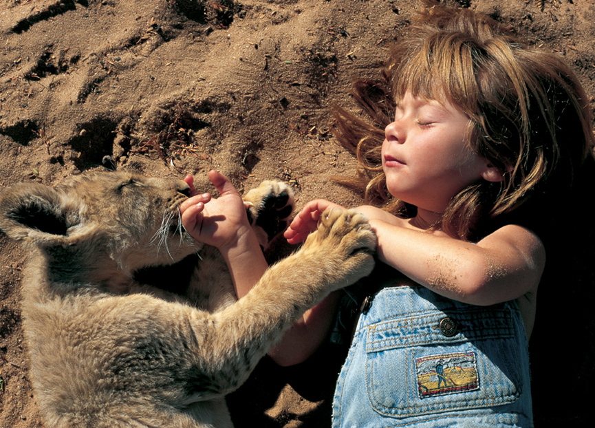 Tippi Degré with lion cub by Alain Degré and Sylvie Robert